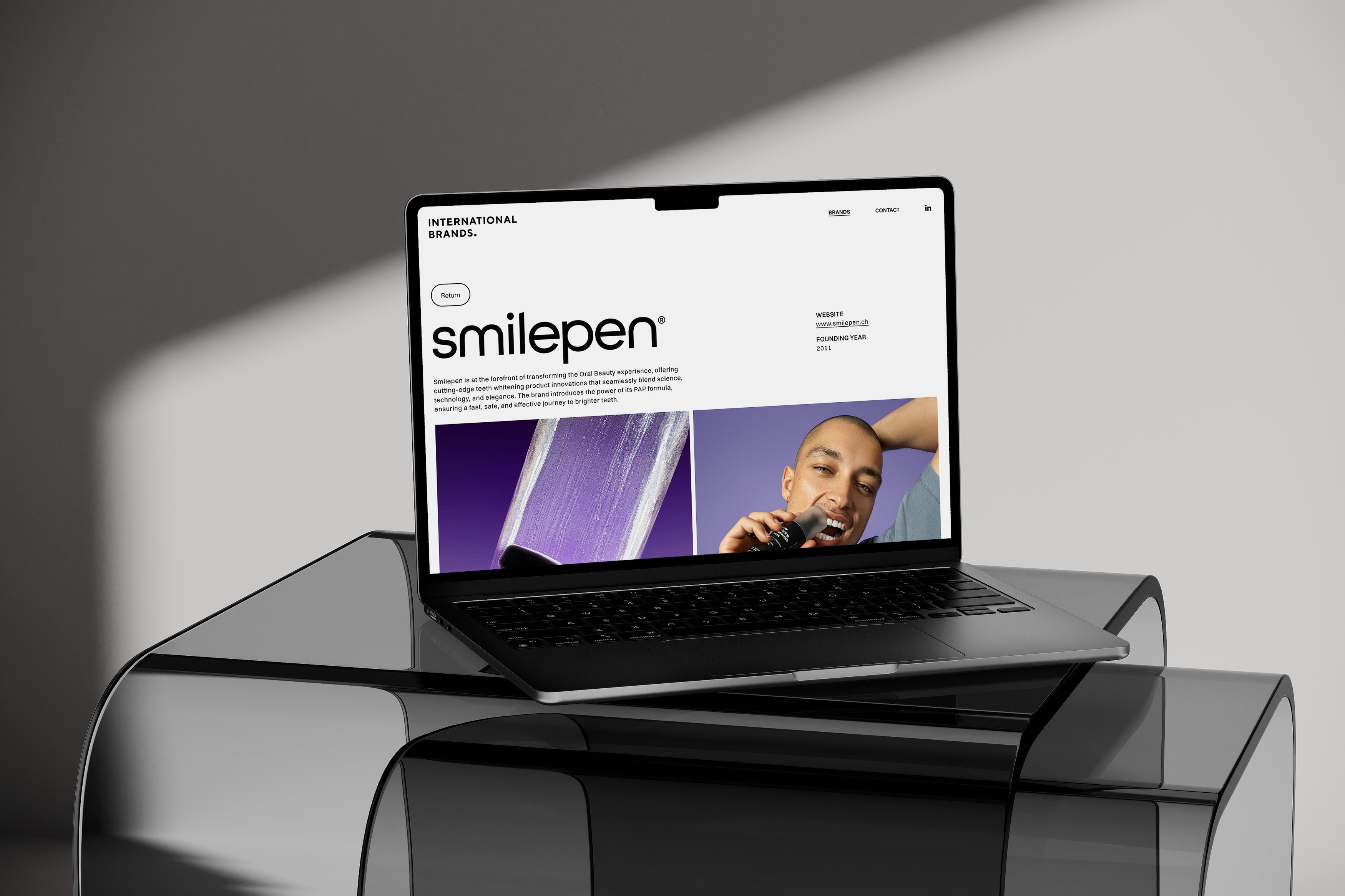 Stationery design of letterhead and business cards for the company Anders on top of a blurred photo of a house interior.