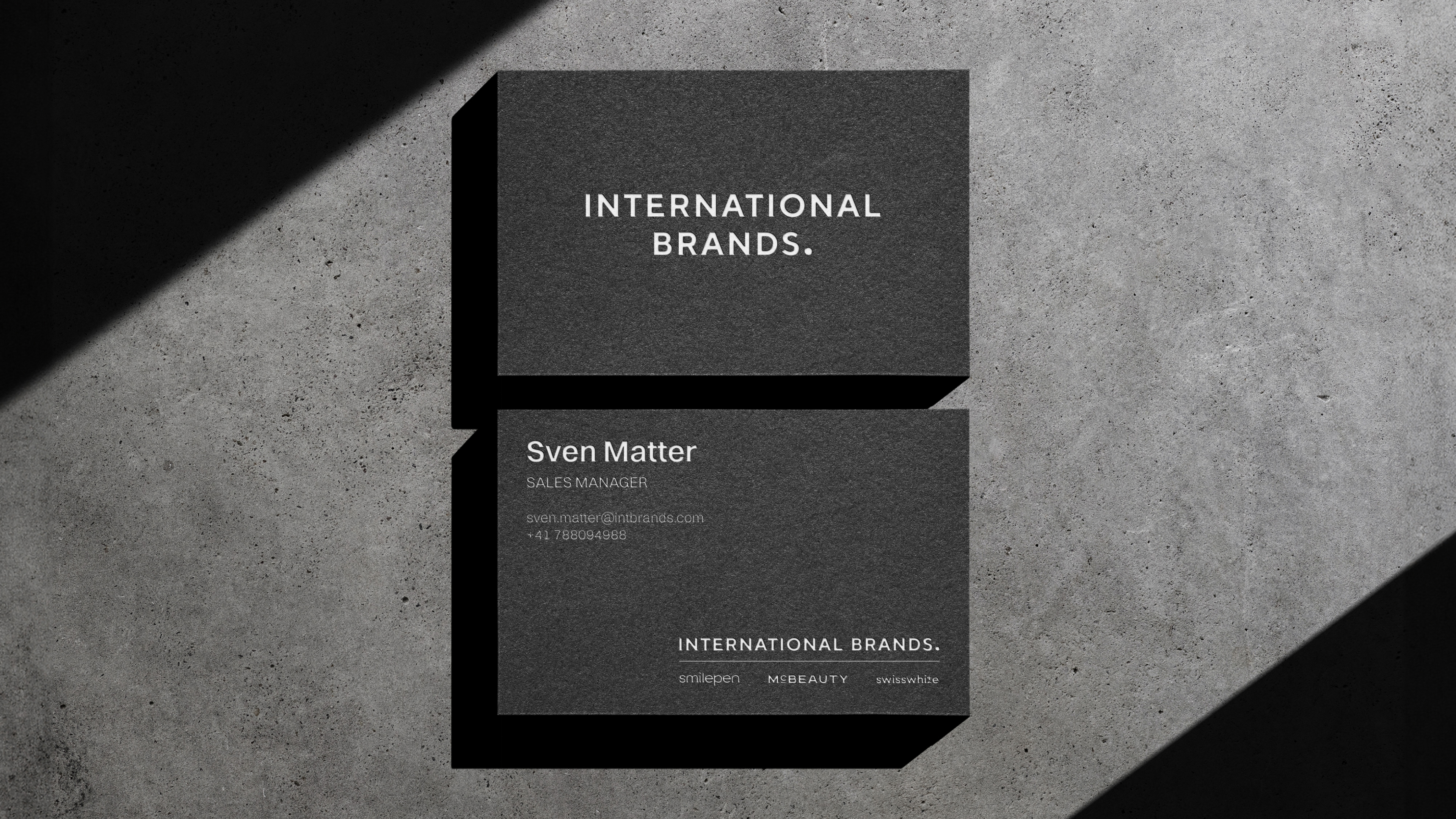 Stationery design of letterhead and business cards for the company Anders on top of a blurred photo of a house interior.