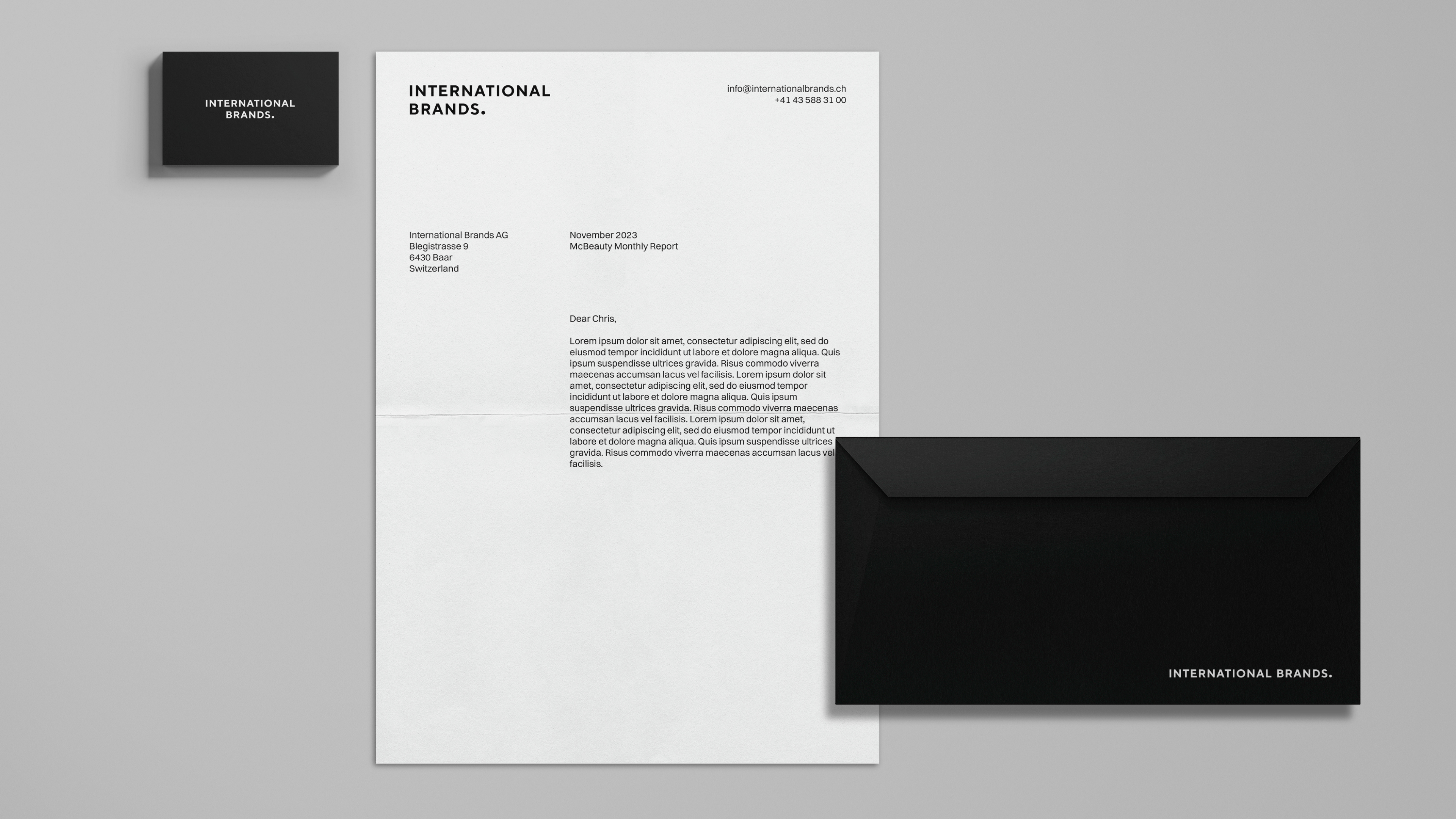 Stationery design of letterhead and business cards for the company Anders on top of a blurred photo of a house interior.